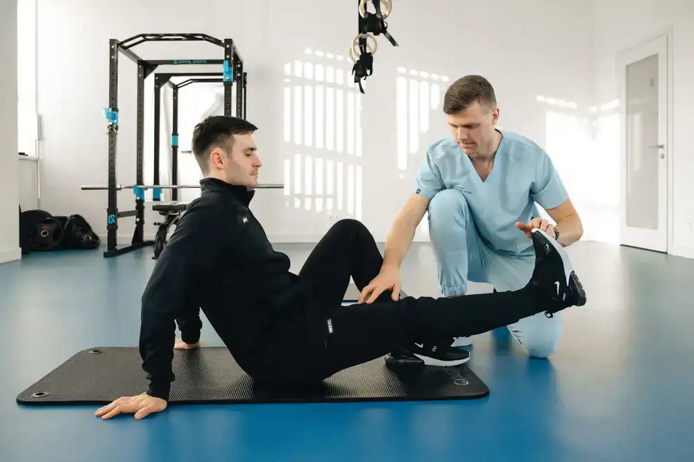 Patient performing guided strength exercises in the clinic