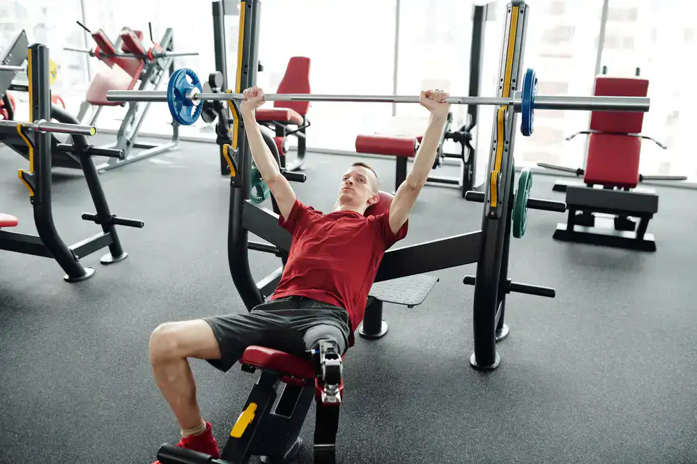Modern functional rehabilitation space featuring agility turf and heavy weights
